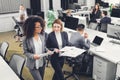 High angle view of professional young multiethnic businesswomen holding documents and discussing project Royalty Free Stock Photo