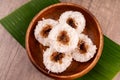 Putu bambu or steamed rice flour cake with grated coconut and palm sugar filling