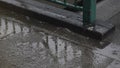 High-angle view of rain drizzles on the street floor by the staircase