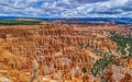 High angle view of the red rocks under the cloudy sky in the Bryce Canyon National Park, Utah, USA Royalty Free Stock Photo