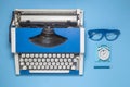 High angle view of retro journalist objects on blue background