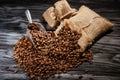 high angle view of sacks of coffee beans and scoop on rustic Royalty Free Stock Photo