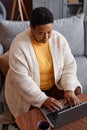Senior black woman using laptop while working from home Royalty Free Stock Photo