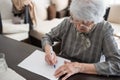 High angle view of a senior woman doing Alzheimer`s disease cognitive functions self assessment test at home Royalty Free Stock Photo