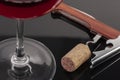 High angle view with shallow depth of field of a glass of red wine with a sommelier tools Royalty Free Stock Photo