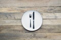 Silver knife and fork on an empty plate