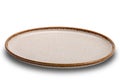 High angle view of single empty round spotted brown ceramic plate with brown edge