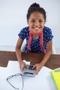 High angle view of smiling businesswoman using calculator Royalty Free Stock Photo