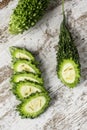 Slices of raw karela on a table