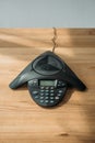 high angle view of speakerphone on wooden table