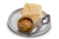 High angle view stack of rice crackers with peanut sauce in brown ceramic cup