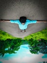 High angle view of Street and a boy lying down on the road