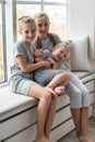 High angle view of sweet happy Caucasian children siblings girl and boy playing tag at home