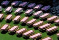 High angle view of tables and chairs on the lawn in a park under the sunlight Royalty Free Stock Photo