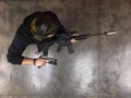High angle view of a tactical shooter holding a suppressed assault rifle and a pistol during a professional training session Royalty Free Stock Photo