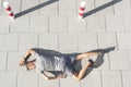 High angle view of tired sporty man lying on sidewalk Royalty Free Stock Photo