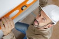 high angle view tradesman using spirit level Royalty Free Stock Photo