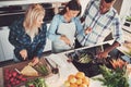 High angle view of trio cooking a meal