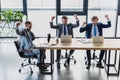 high angle view of triumphing young businessmen working with laptops Royalty Free Stock Photo