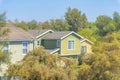 High angle view of two houses with green wood vinyl lap sidings in Ladera Ranch, California