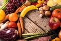 High angle view of various vegetables and fruits with empty heart shape made on wooden table Royalty Free Stock Photo