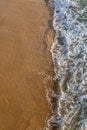 A high angle view of waves lapping the shoreline