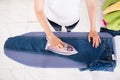High Angle View Of Woman Ironing Jeans Royalty Free Stock Photo