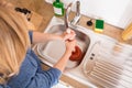 High Angle View Of Woman Using Plunger In Sink Royalty Free Stock Photo