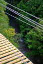 High angle view of wooden deck of a simple suspension bridge aka rope bridge, suspended bridge, hanging bridge, or catena Royalty Free Stock Photo