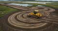 Earthmoving equipment creating curvilinear patterns in field Royalty Free Stock Photo