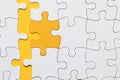 high angle view yellow puzzle piece arranged with white pieces. High quality photo Royalty Free Stock Photo