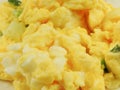 High angle view of yellow scrambled eggs background.