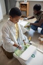 Black Boy Sorting Plastic Royalty Free Stock Photo