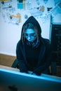 high angle view of young female hacker developing malware under