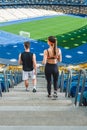 high angle view of young fit couple walking downstairs Royalty Free Stock Photo