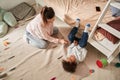 Mom enjoying time with her male baby, while playing with him and looking at him Royalty Free Stock Photo