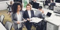 High angle view of young multiethnic businesswomen holding documents and discussing project while walking Royalty Free Stock Photo