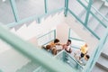 high angle view of young students walking down stairs Royalty Free Stock Photo
