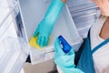 High Angle View Of Woman Cleaning Refrigerator Royalty Free Stock Photo