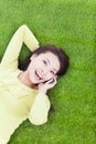 High angle view of a young woman talking with smartphone Royalty Free Stock Photo