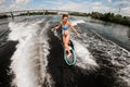 High angle view of young woman who rides on the wakeboard Royalty Free Stock Photo