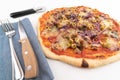 High angle wide studio shot of freshly baked pizza al tonno isolated on white background. Tuna, olives, onions, veggies Royalty Free Stock Photo