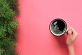 High angle of woman hands holding coffee mug on pink background Minimalistic style. Flat lay, top view isolated Royalty Free Stock Photo