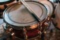 Wooden drumsticks on drum on stage in club