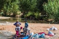 High Atlas, Morocco - September 19, 2015 - women washing laundry in a river Royalty Free Stock Photo