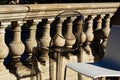 High bar chairs in closeup view on open terrace wih old stone balustrade background Royalty Free Stock Photo