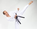 High blow mawashi geri is beating sportsman Royalty Free Stock Photo