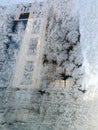 High building throw frozen window View from the car Winter time Royalty Free Stock Photo