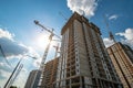 High building under construction with cranes and blue sky Royalty Free Stock Photo