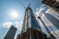 High building under construction with cranes and blue sky Royalty Free Stock Photo